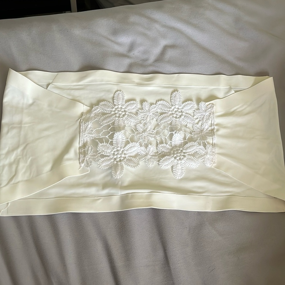 white tube top with flower detail in the back